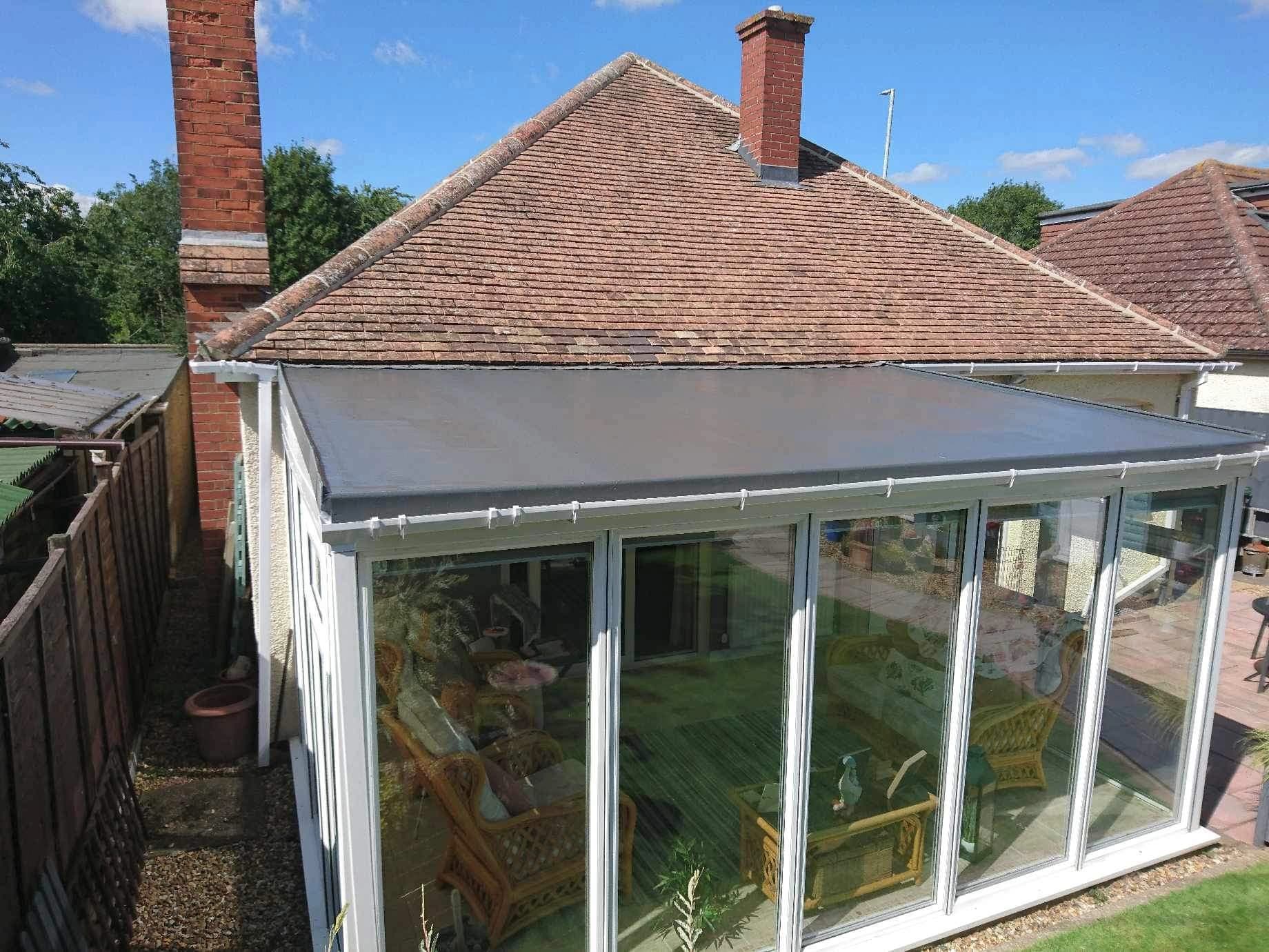 Home with flat conservatory roof